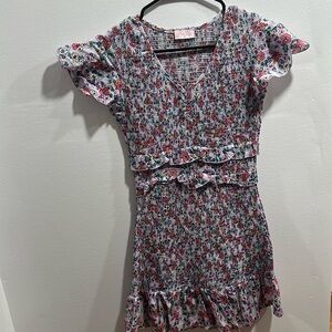 Purple floral. Stretchy and ruffles.